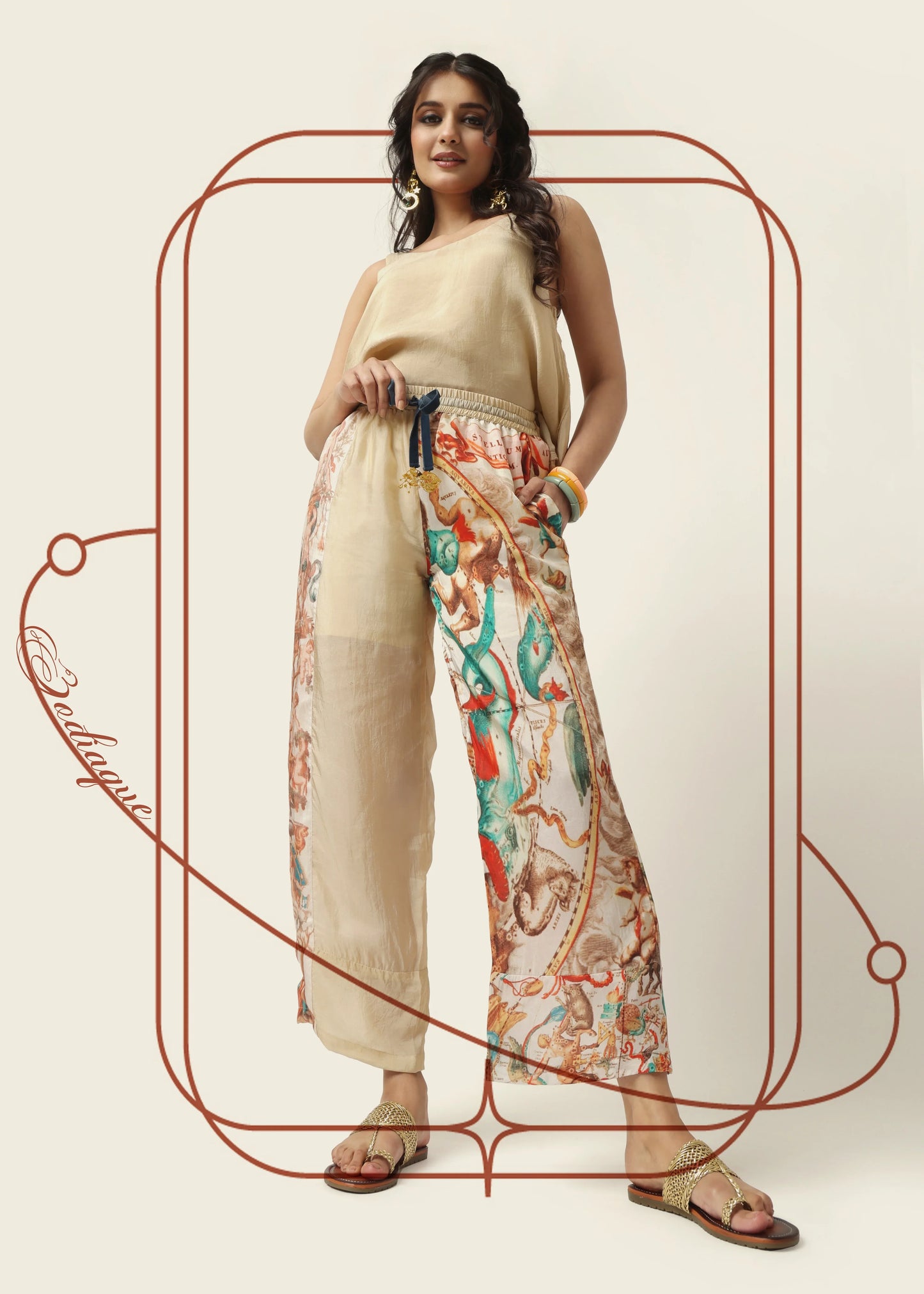 Beige wide-leg silk trousers with multicolor mystical vintage motifs, elastic waist, pockets, styled for tenue chic femme by . - Pantalon ZODIAQUE - S - ALTER EGO