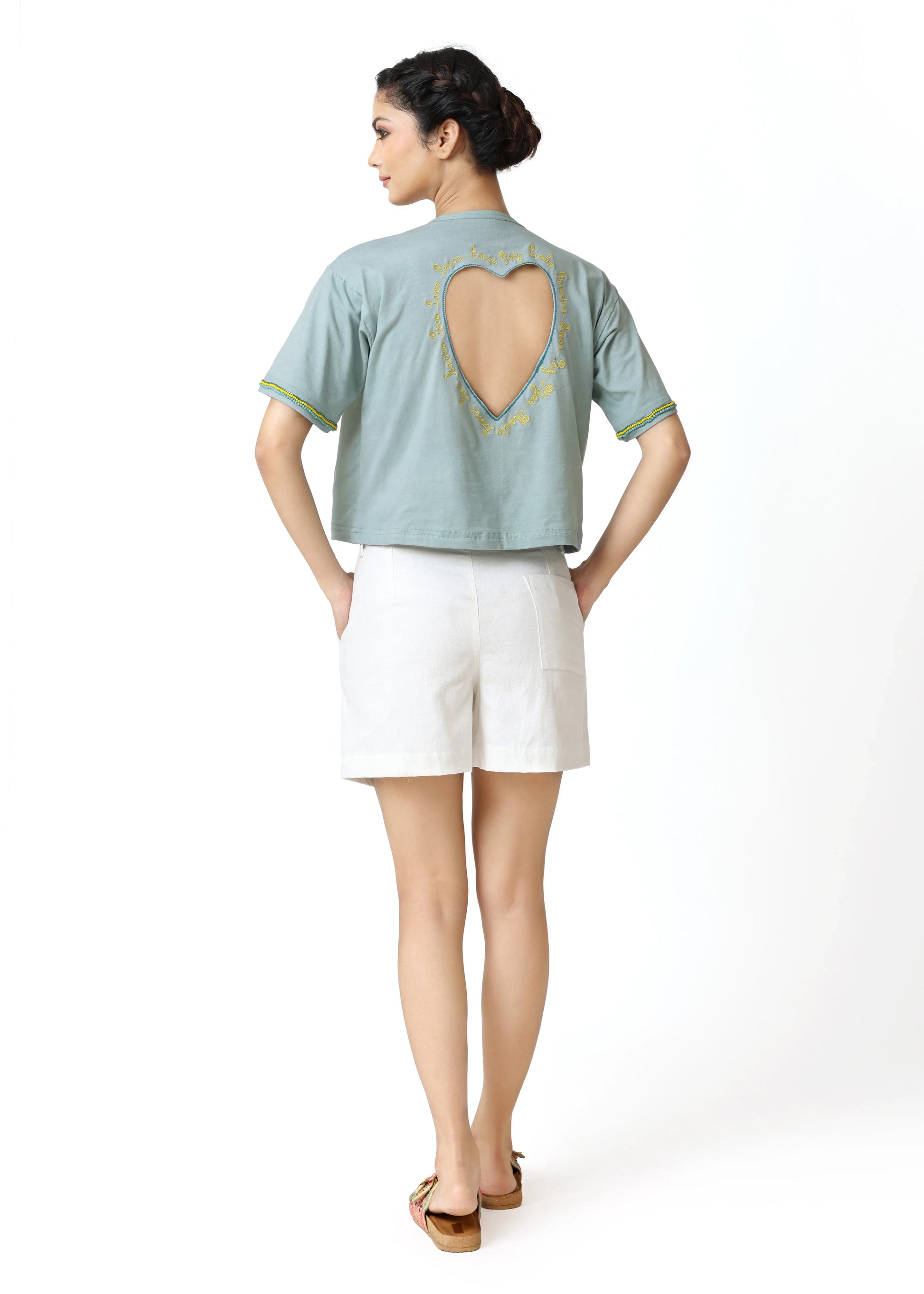 Light blue cropped tee-shirt with heart-shaped cutout on back, round neckline, short sleeves, styled with white shorts,. - Tee-shirt HEART - S - ALTER EGO