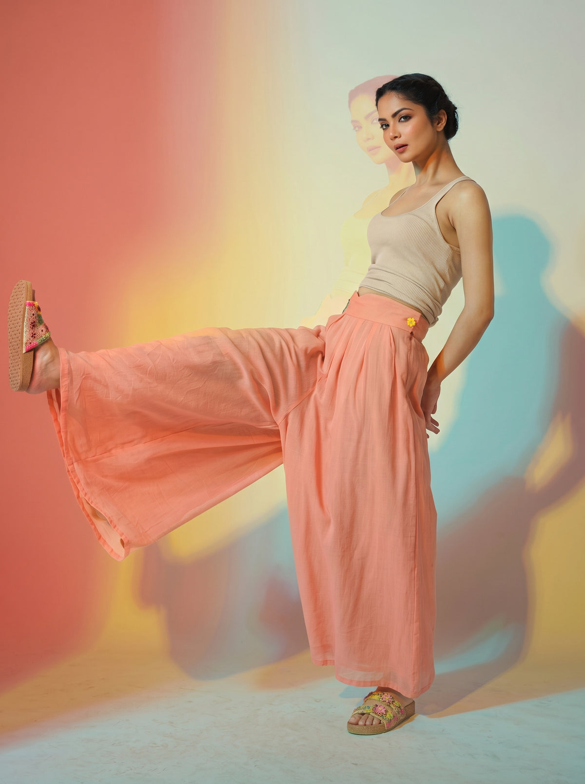 Woman modeling a flowing coral wide-leg BLOOM trouser with a high waist and lightweight, sheer-looking fabric. - Pantalon BLOOM - S - ALTER EGO