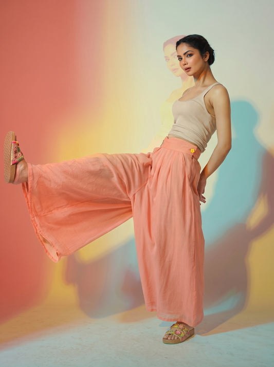 Woman modeling a flowing coral wide-leg BLOOM trouser with a high waist and lightweight, sheer-looking fabric. - Pantalon BLOOM - S - ALTER EGO