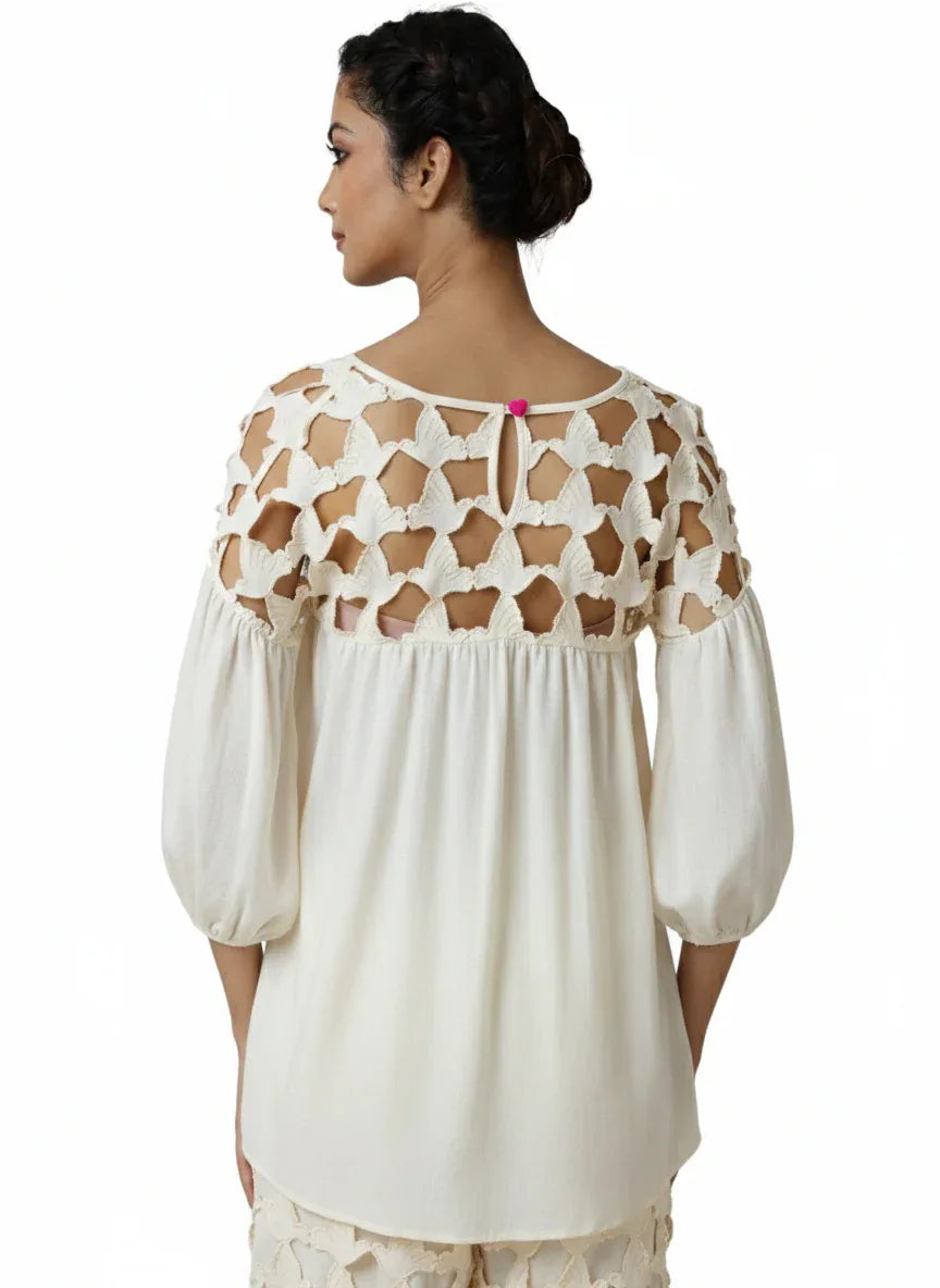Off-white blouse with intricate cut-out lace yoke, flowing fabric, and billowy three-quarter sleeves, embodying tenue chic. - Blouse DOVE - XS / Bleu - ALTER EGO
