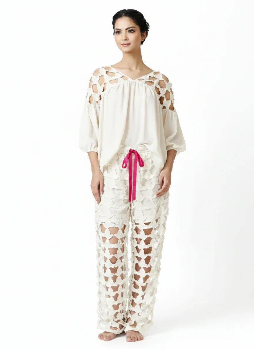 Off-white wide-leg pantaloon with intricate lace broderie, elastic waist, styled with a loose, elegant blouse, showcasing. - Pantalon DOVE - S / Bleu - ALTER EGO