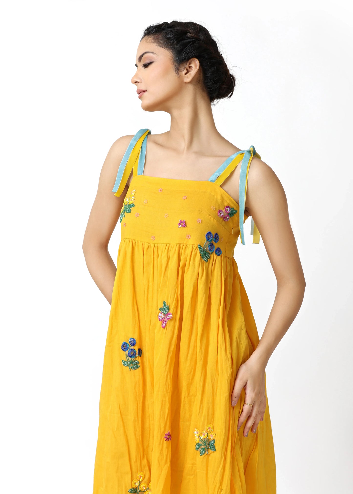 Yellow sleeveless robe femme élégante with multicolored floral embroidery, tie straps, flowing skirt, embodying mode. - Robe BLOOM - S - ALTER EGO